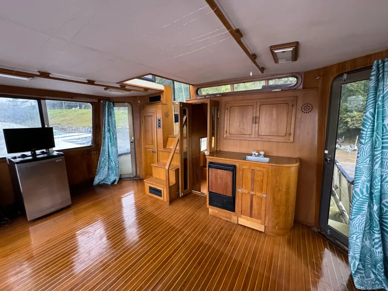 Slide: The Image of Interior of 1988 Vista 43 Motor Yacht with wood flooring and cabinetry. - 4