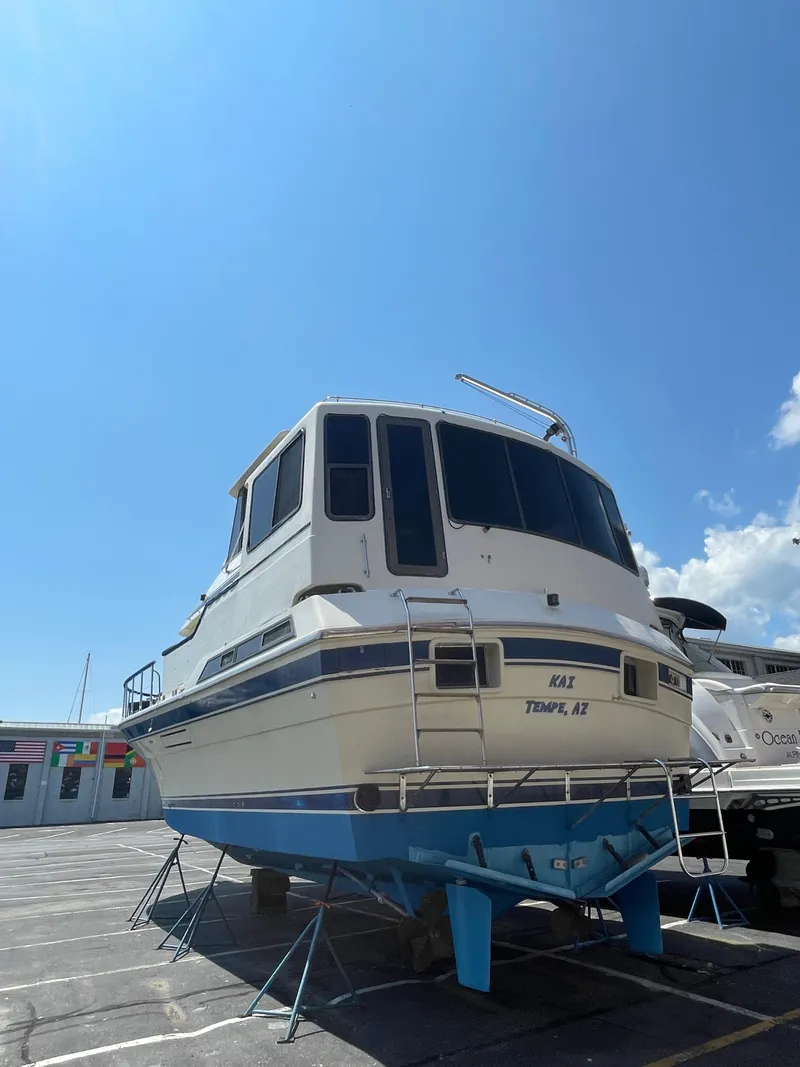 Slide: The Image of 1988 Vista 43 Motor Yacht on stands under a clear blue sky. - 44