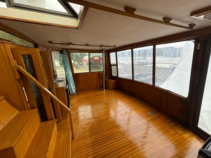 Slide: The Image of Interior of 1988 Vista 43 Motor Yacht with wooden flooring and large windows. - 7
