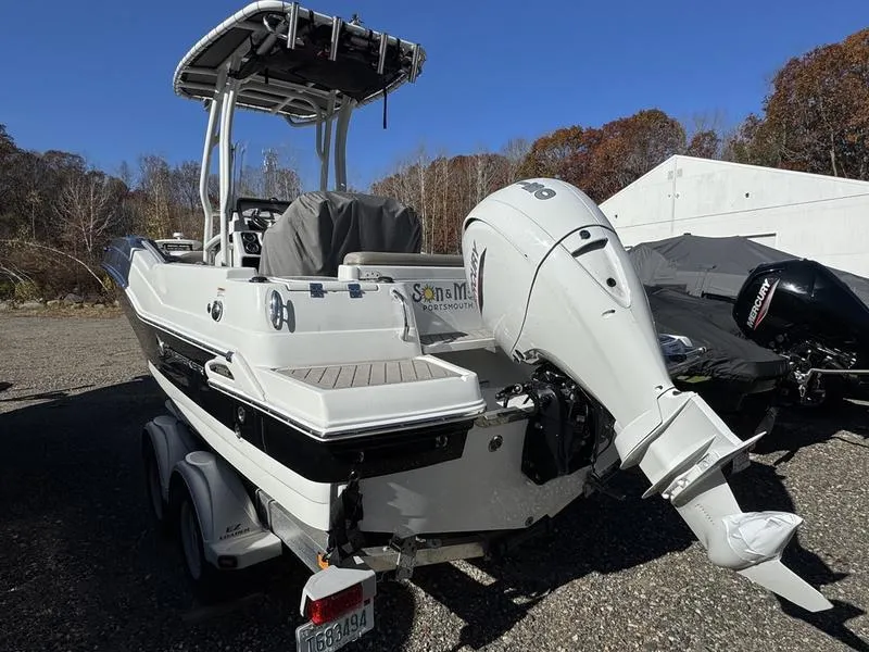 Slide: The Image of 2021 Finseeker 200 FS boat with outboard motor, parked on a trailer. - 4