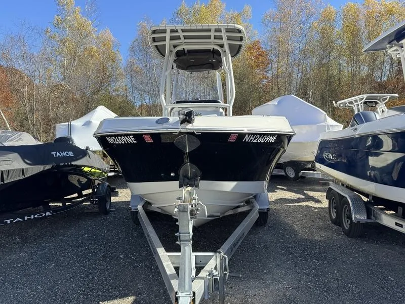 Slide: The Image of 2021 Finseeker 200 FS boat on trailer, surrounded by other boats, in outdoor storage. - 6