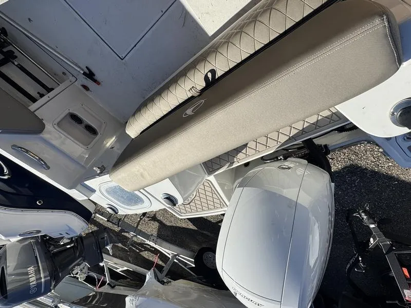 Slide: The Image of 2021 Finseeker 200 FS boat interior with cushioned seating and outboard motor. - 7