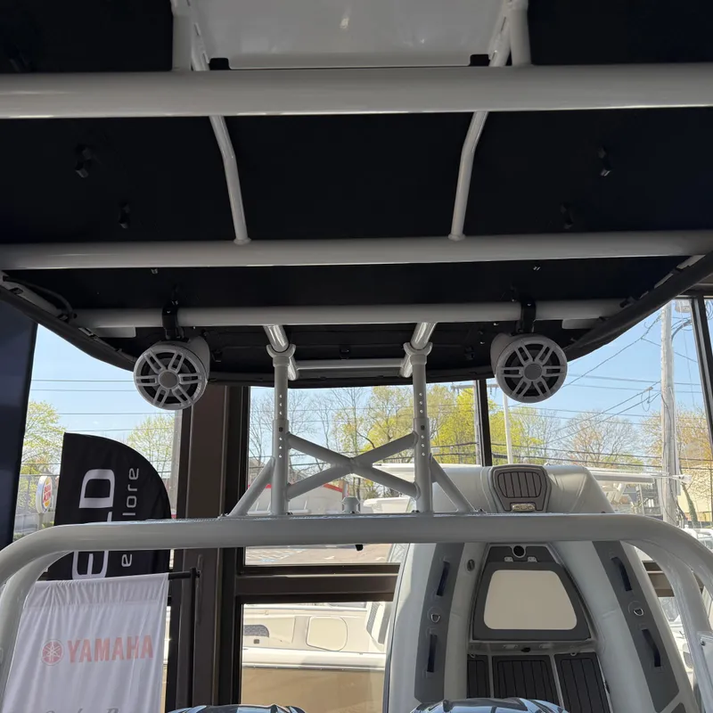 Slide: The Image of 2025 Highfield Patrol 860 boat interior with speakers and structural framework. - 10