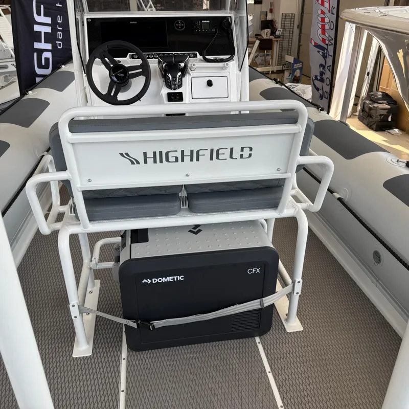 Slide: The Image of 2025 Highfield Patrol 860 boat interior with steering console and Dometic CFX cooler. - 11