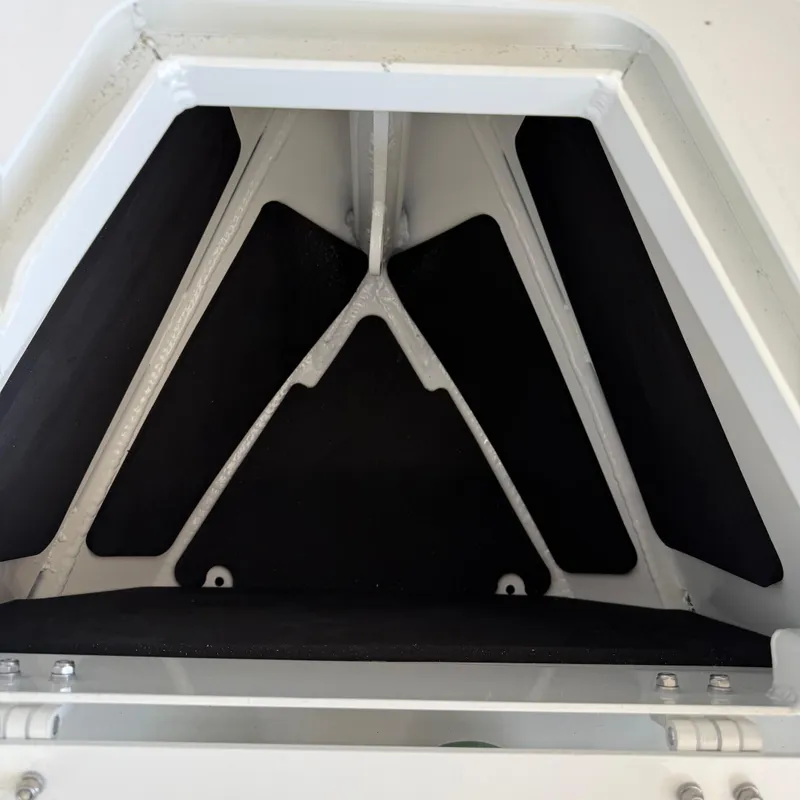 Slide: The Image of Interior view of 2025 Highfield Patrol 860 boat compartment with black padding. - 20