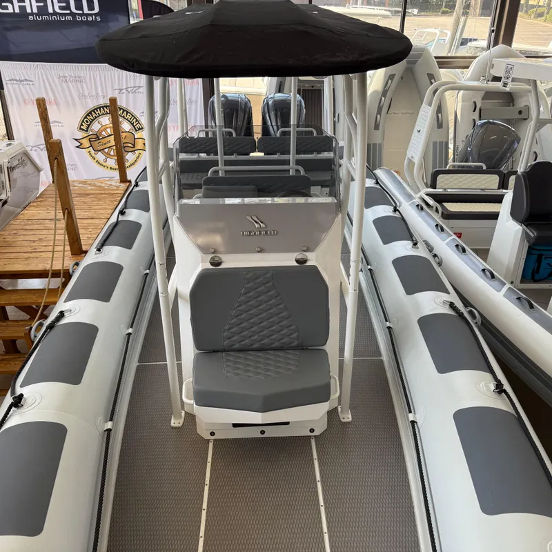 Slide: The Image of 2025 Highfield Patrol 860 boat interior with seating and canopy. - 22