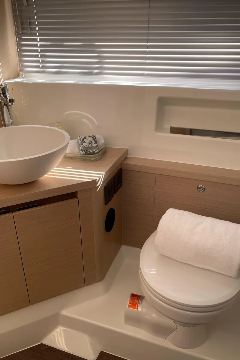 Slide: The Image of Luxurious bathroom in 2025 Jeanneau DB/37 OB yacht with modern fixtures and elegant design. - 13