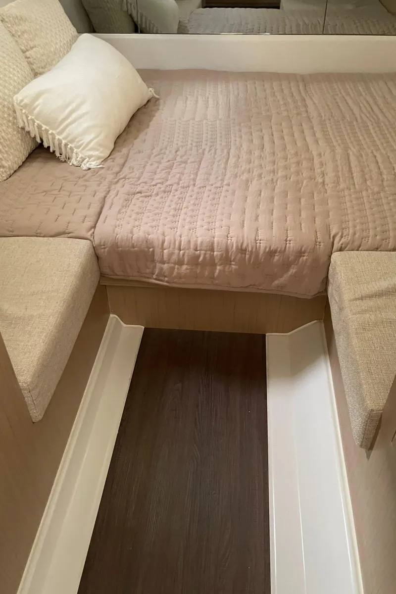 Slide: The Image of 2025 Jeanneau DB/37 OB cabin interior with cozy bed and modern design. - 15