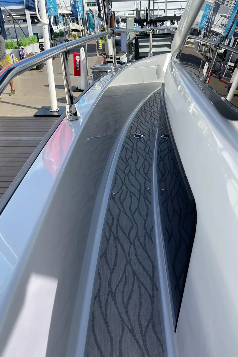 Slide: The Image of 2025 Jeanneau DB/37 OB boat deck with sleek design and textured flooring. - 8
