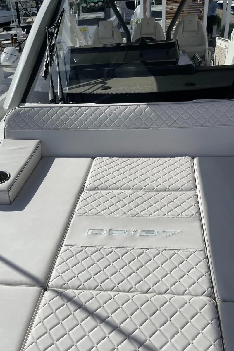 Slide: The Image of 2025 Jeanneau DB/37 OB boat with luxurious quilted seating. - 9