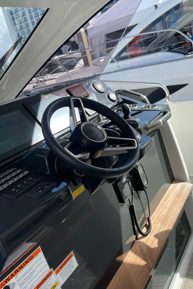 Slide: The Image of 2025 Jeanneau DB/37 OB helm with modern controls and steering wheel. - 20
