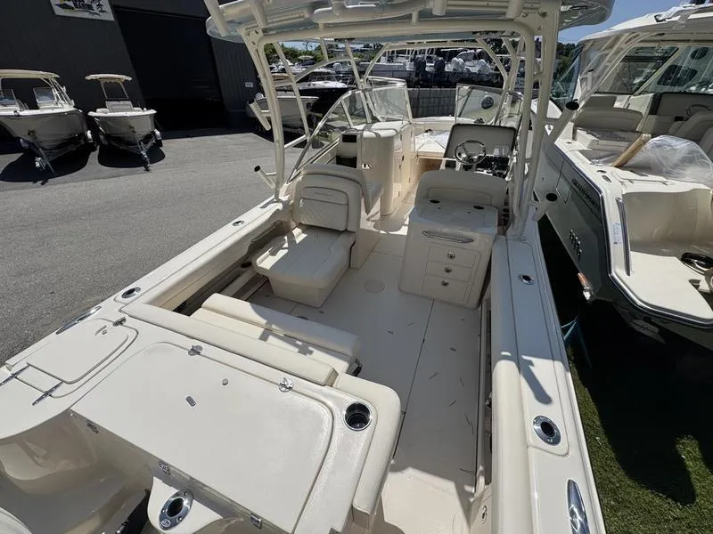 Slide: The Image of 2025 Grady-White Freedom 275 boat interior, featuring spacious seating and modern design. - 6