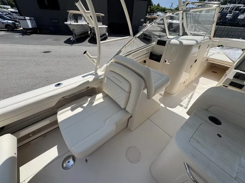 Slide: The Image of 2025 Grady-White Freedom 275 boat interior with seating and helm station. - 7
