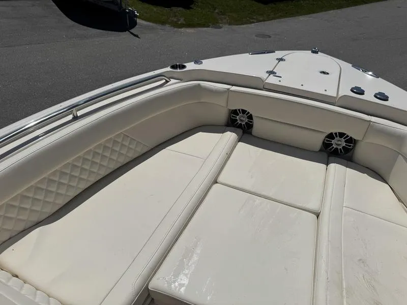 Slide: The Image of 2025 Grady-White Freedom 275 boat with spacious white seating and modern design. - 8