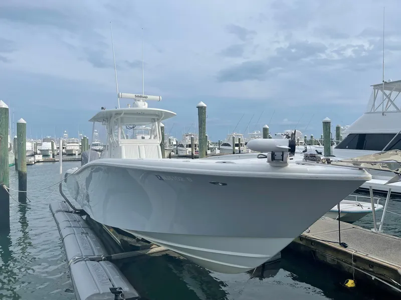 Slide: The Image of 2009 Yellowfin 36 Center Console boat docked at marina. - 2