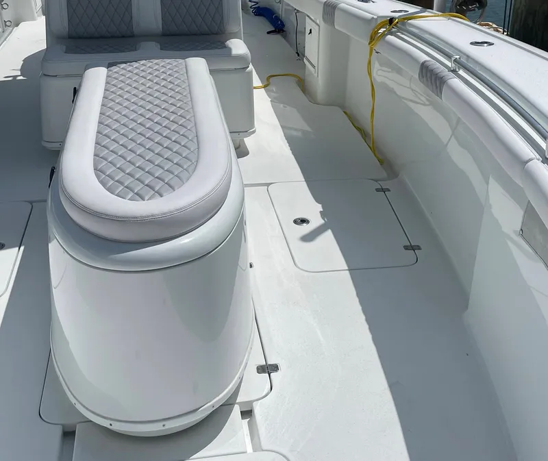 Slide: The Image of 2009 Yellowfin 36 Center Console boat interior with quilted seating and spacious deck. - 7
