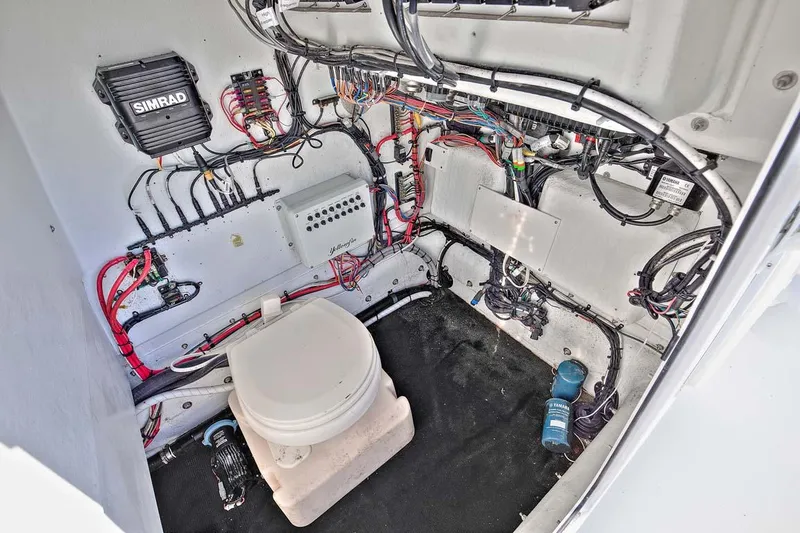Slide: The Image of 2009 Yellowfin 36 Center Console boat interior with wiring and equipment. - 9