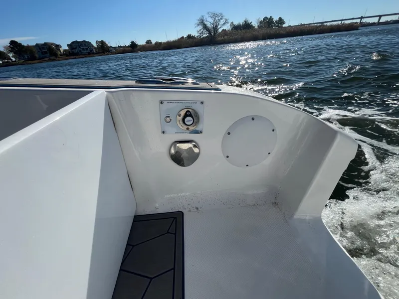 Slide: The Image of 2022 Fountain 34 SC boat interior with water view and control panel. - 11