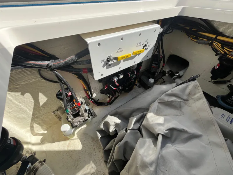 Slide: The Image of 2022 Fountain 34 SC boat wiring and control panel in storage compartment. - 17