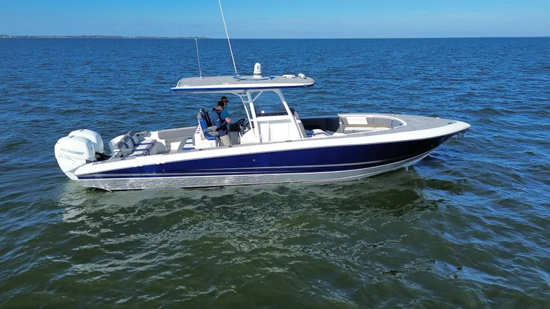 Slide: The Image of 2022 Fountain 34 SC boat cruising on open water. - 2