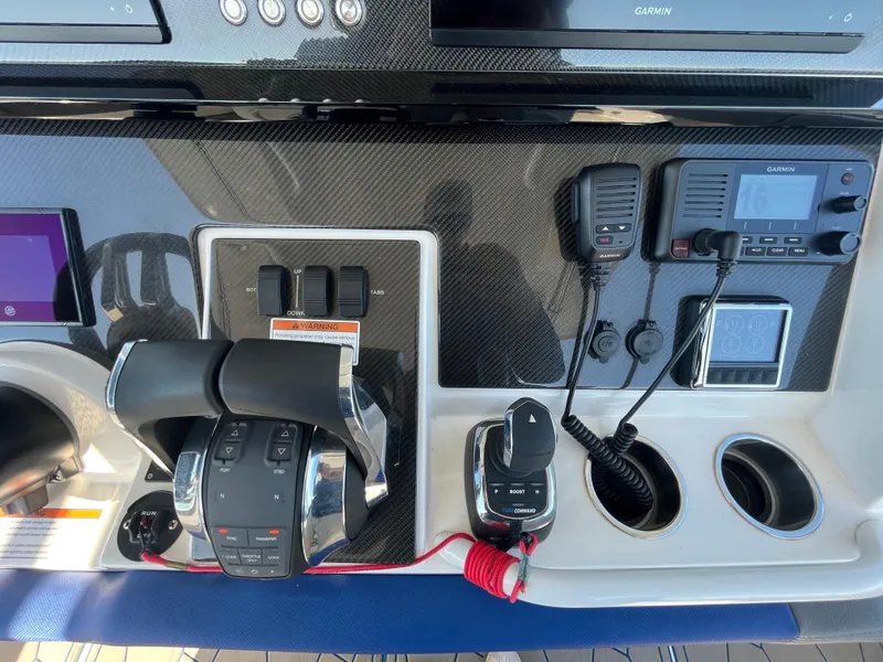 Slide: The Image of Control panel of 2022 Fountain 34 SC boat with navigation and communication equipment. - 28