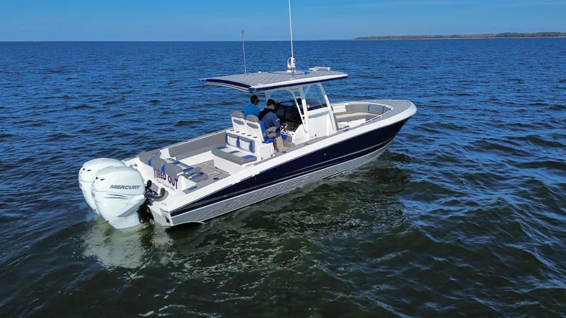 Slide: The Image of 2022 Fountain 34 SC boat cruising on open water. - 3