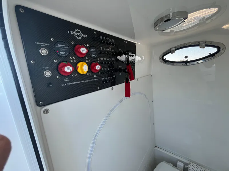 Slide: The Image of Control panel of 2022 Fountain 34 SC boat with switches and gauges. - 31