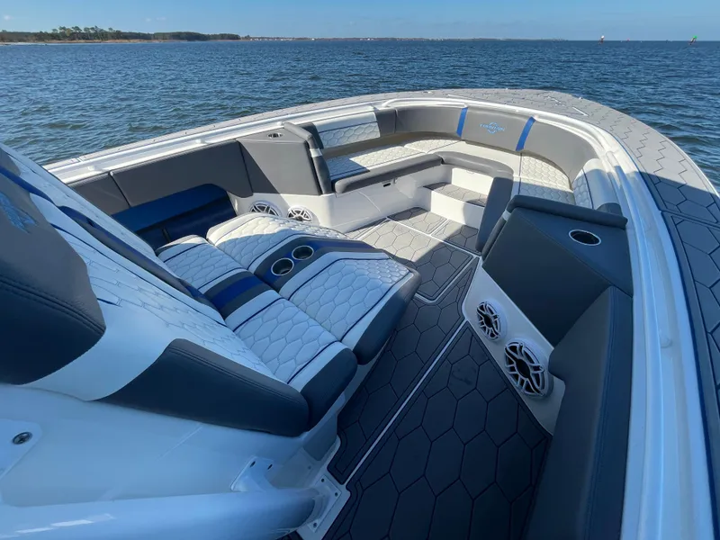 Slide: The Image of 2022 Fountain 34 SC boat interior with luxurious seating and ocean view. - 32