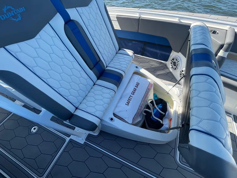 Slide: The Image of 2022 Fountain 34 SC boat interior with safety gear storage. - 35
