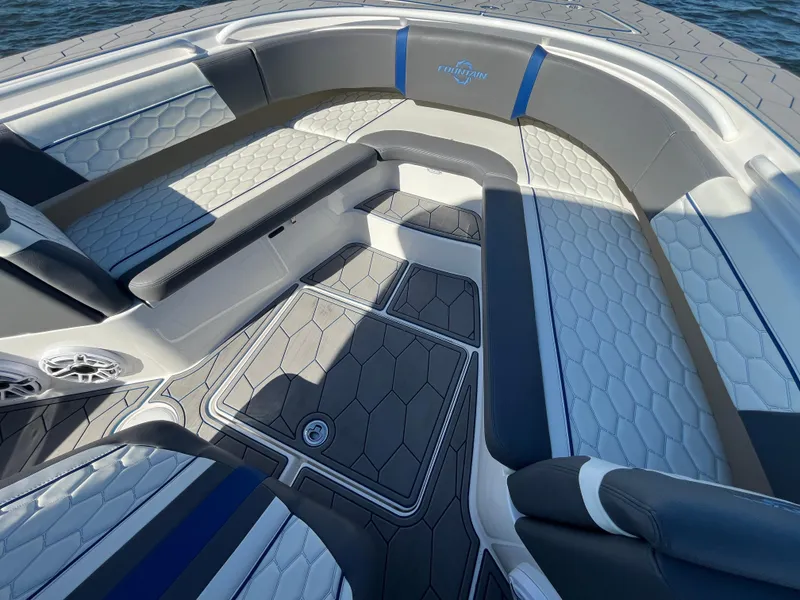 Slide: The Image of Luxurious seating area on 2022 Fountain 34 SC boat, featuring modern design and comfortable upholstery. - 36