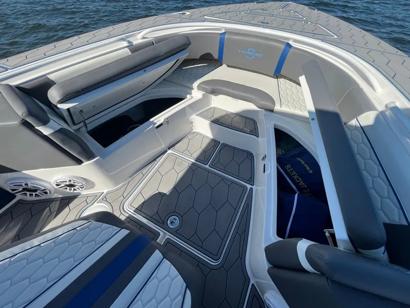 Slide: The Image of 2022 Fountain 34 SC boat interior with sleek seating and modern design. - 37