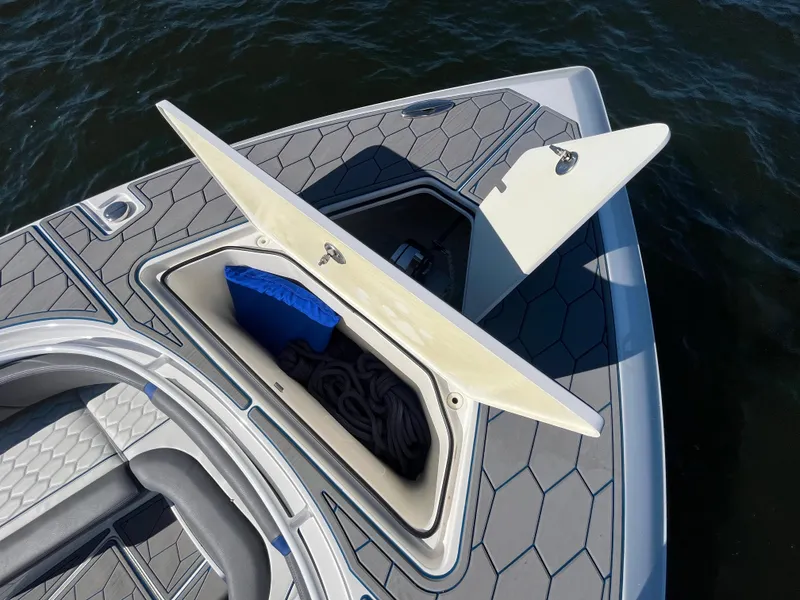 Slide: The Image of 2022 Fountain 34 SC boat with open storage compartment on deck. - 39