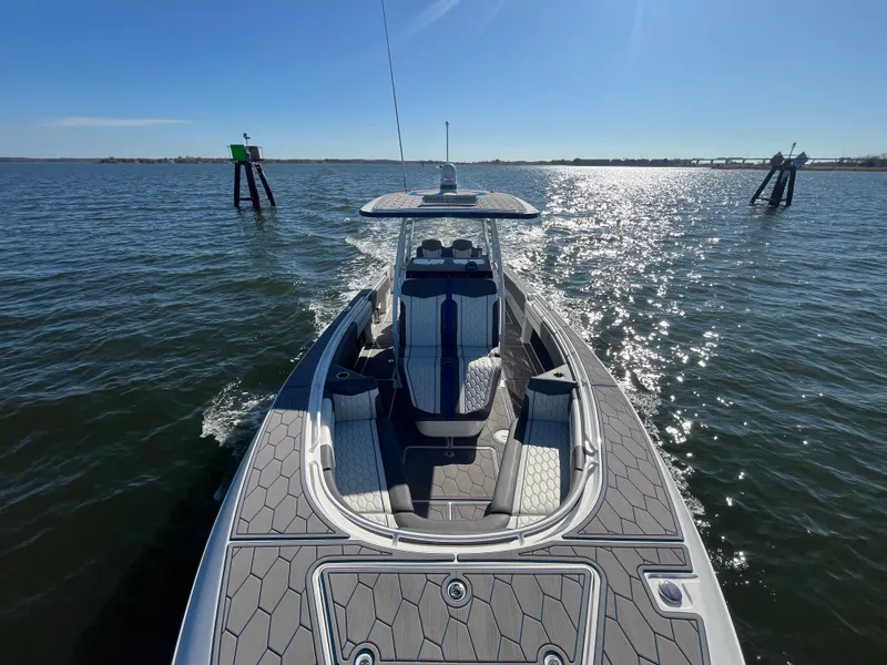 Slide: The Image of 2022 Fountain 34 SC boat cruising on sunny waters. - 40