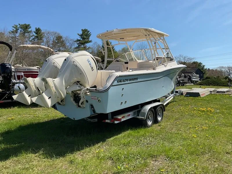 Slide: The Image of 2025 Grady-White Freedom 275 boat interior with dual consoles and luxurious seating. - 8