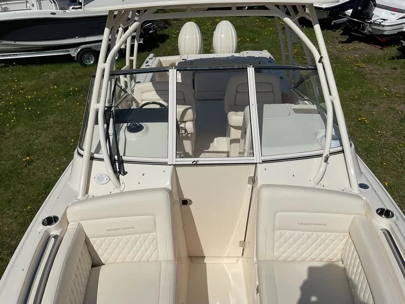 Slide: The Image of 2025 Grady-White Freedom 275 boat cockpit with steering wheel and control panel. - 9