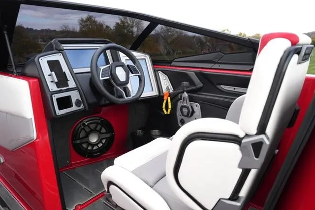 Slide: The Image of 2021 Supra SE 450 boat interior with modern dashboard and steering wheel. - 10