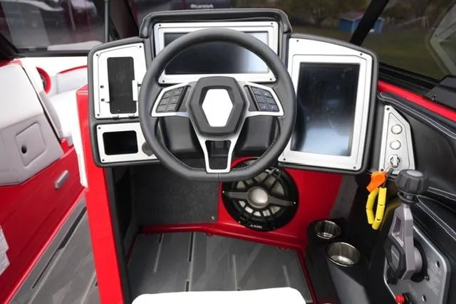 Slide: The Image of 2021 Supra SE 450 boat dashboard with modern controls and touchscreen displays. - 11