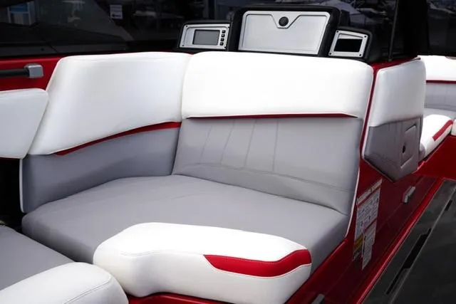 Slide: The Image of 2021 Supra SE 450 boat interior with white and gray seating. - 12