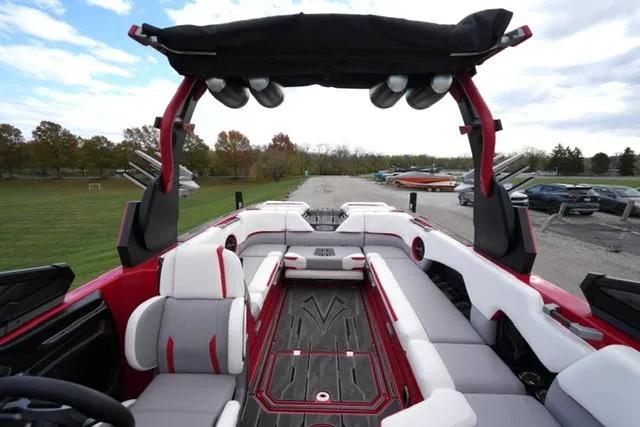 Slide: The Image of 2021 Supra SE 450 boat interior with red and white seating, open-air design. - 14