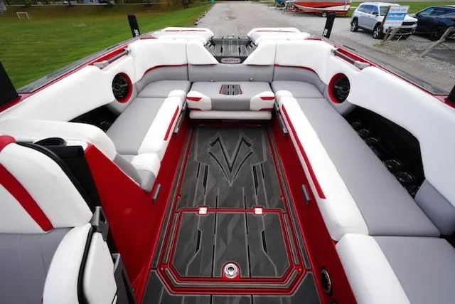 Slide: The Image of 2021 Supra SE 450 boat interior with red and white seating and sleek design. - 15