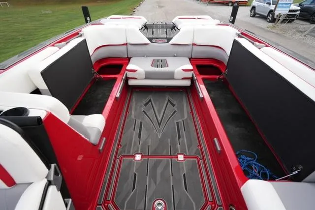 Slide: The Image of 2021 Supra SE 450 boat interior with red and white seating, spacious layout. - 16
