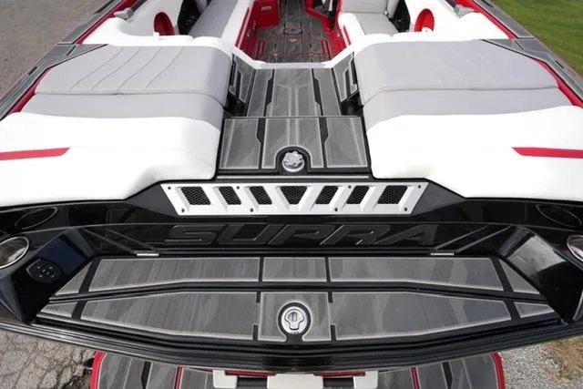 Slide: The Image of 2021 Supra SE 450 boat interior with sleek seating and modern design. - 17