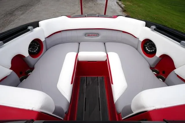 Slide: The Image of 2021 Supra SE 450 boat interior with red and white seating and built-in speakers. - 6