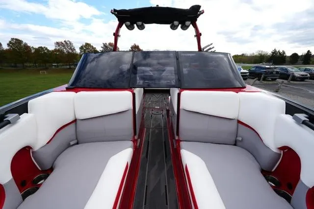 Slide: The Image of 2021 Supra SE 450 boat interior with white and red seating. - 8