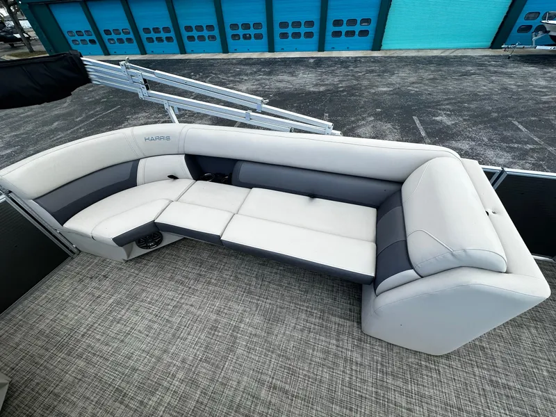 Slide: The Image of 2023 Harris Cruiser 230 boat interior with gray and white seating. - 12