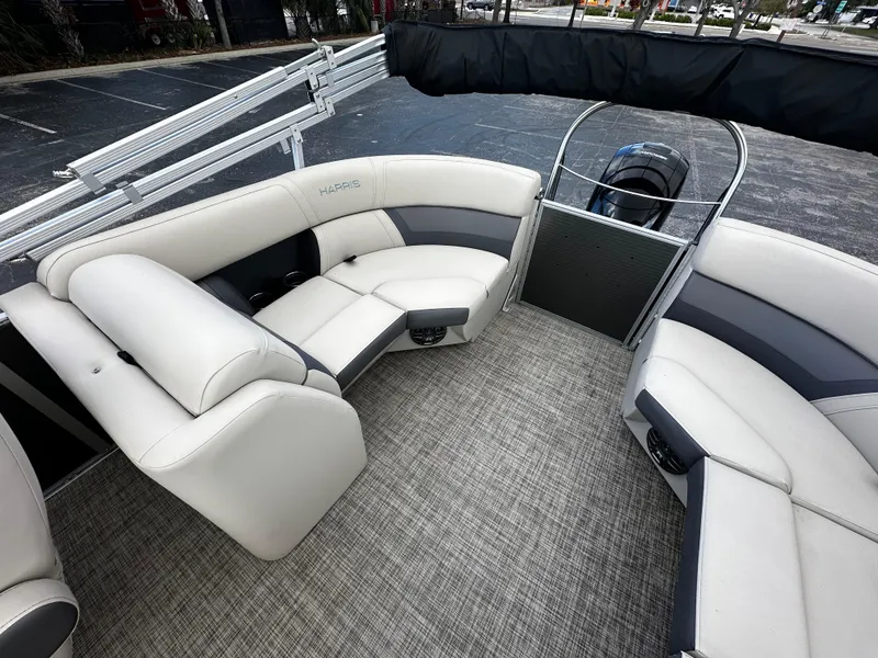 Slide: The Image of 2023 Harris Cruiser 230 pontoon boat interior with plush seating and modern design. - 13
