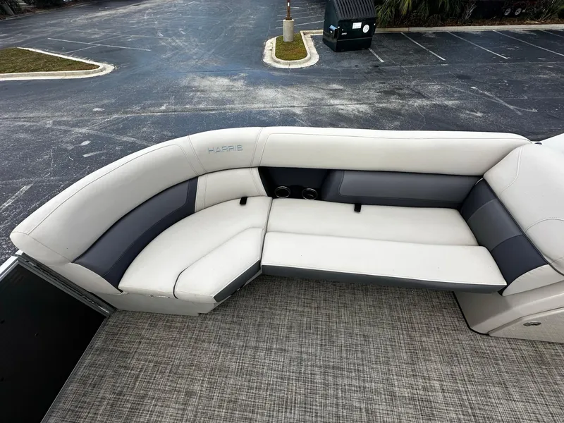 Slide: The Image of 2023 Harris Cruiser 230 boat interior with plush seating and modern design. - 6