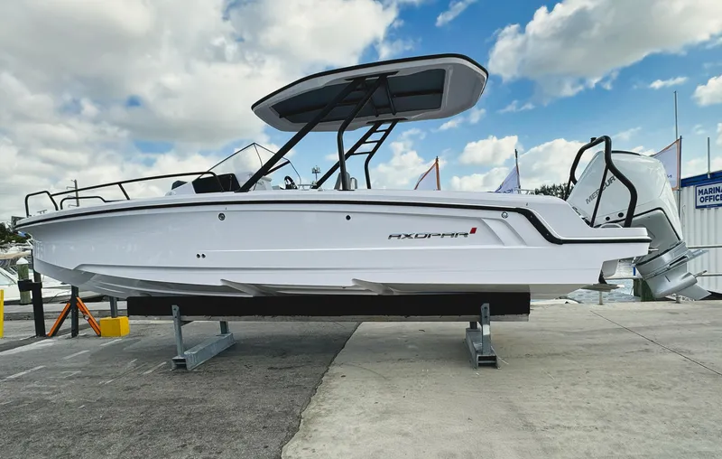 Slide: The Image of 2025 Axopar 25 Cross Top boat on display, featuring sleek design and modern features. - 1