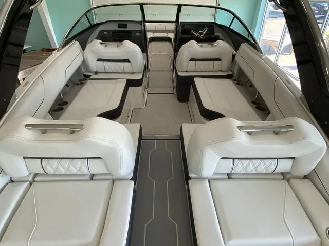 Slide: The Image of 2025 Regal LS4 boat interior with luxurious white seating and modern design. - 10