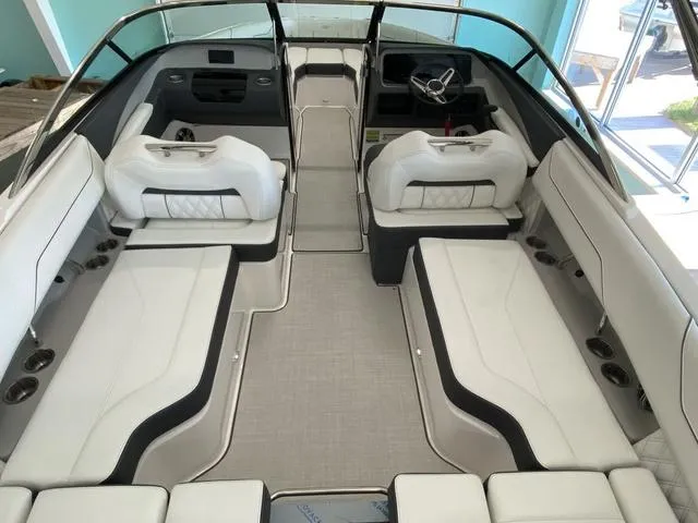 Slide: The Image of 2025 Regal LS4 boat interior with white seating and modern design. - 11